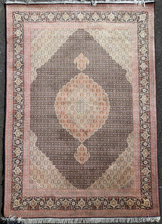 A central Persian carpet, 10ft by 6ft 8in.